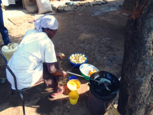 Thobias-His-mother-preparing-food