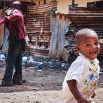 image of a smiling child on the streets of Nairobi
